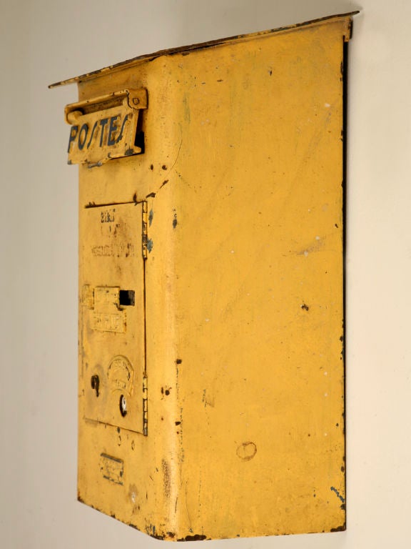 This original, authentic French cast iron street corner mailbox would be the ultimate addition to your Country French estate. It is finished with a warm sunny yellow paint and has the word 