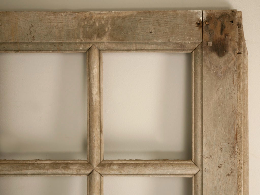 Original hand-carved 18th century French original paint panelled door just removed from a French chateau. A warm complimentary bluish putty gray finish highlights this fine architectural fragment utilized as a door. Perfect as a pantry door in a new
