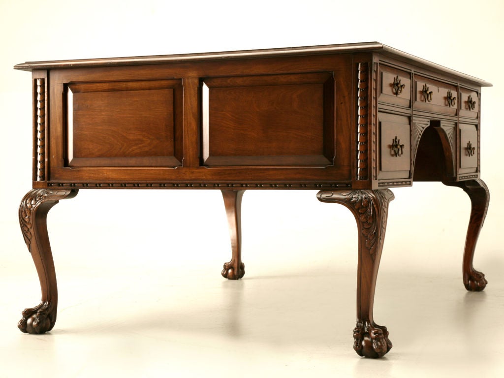 Outrageous antique American solid mahogany 10 drawer partner's desk. Crafted in a classic Chippendale style, this fine desk offers a spot for two people to work at the same time. Partner's desks were once quite plentiful however, nowadays are quite