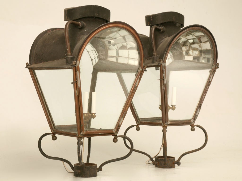 Special pair of original 19th century gas-lit copper post lanterns that have been electrified. They are a spectacular sight with their unique shape and mirrored ceilings. Originally fitted as gas lanterns mounted as post lights, these could be