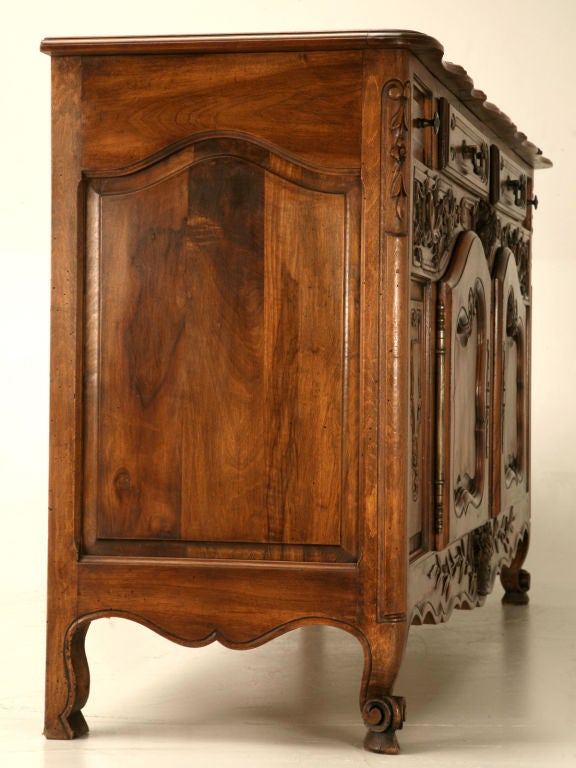 Very special original antique French walnut Rococo buffet with some of the most intricate, highly detailed carvings we have seen in quite sometime. Breathtaking, this 2 over 2 buffet has all the characteristics one could ever want, even the ends