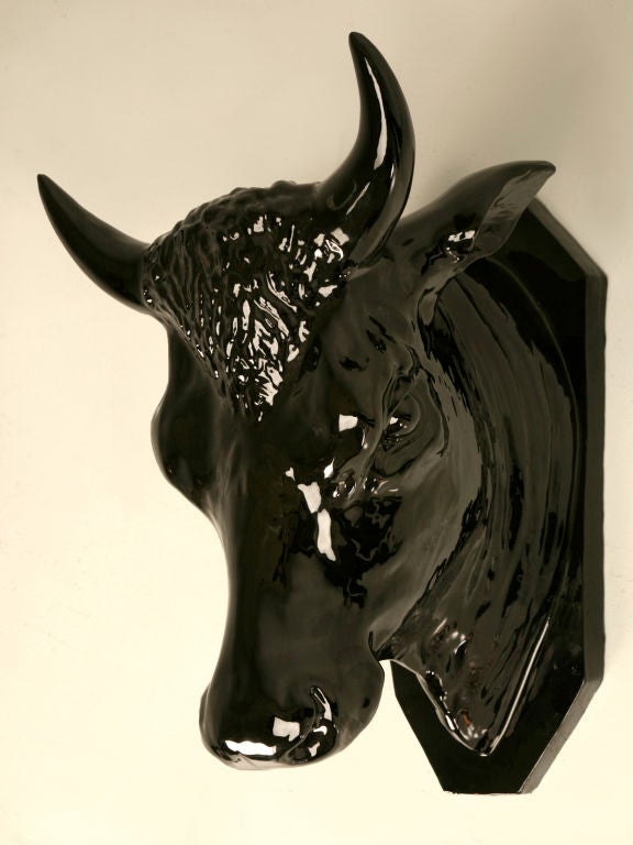 Outstanding vintage French terracotta bull relief with a stunning black glaze. Probably cast from an original antique, this beauty has adorned our showroom for many years. It is only now that we are relocating to a larger more permanent home that