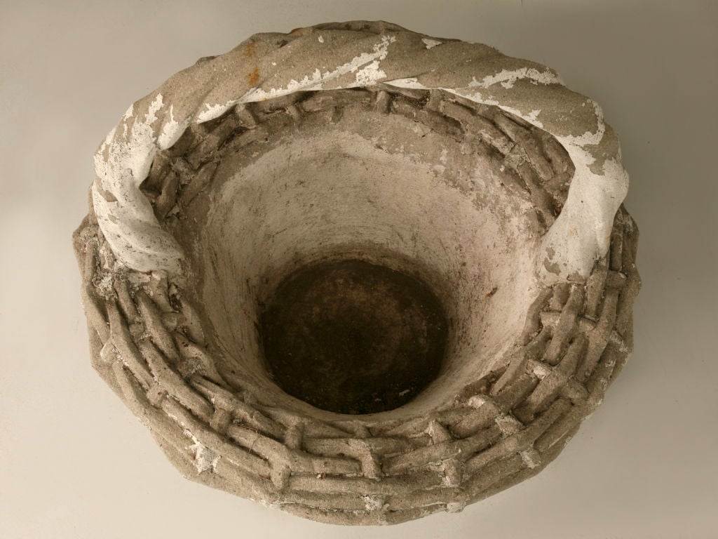 A tisket, a tasket, a lovely garden basket. This is a real beauty, whomever crafted this basket, had an amazing eye for detail. From a distance, or up close, this basket appears to be woven. Picture it now on the lawn of your estate with its ever