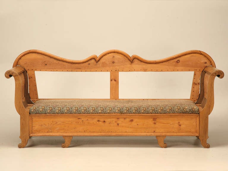 19th C. Danish pine sleeping bench with curves in all the right places is looking for a new home. This beloved piece of history has remained a long time lake house resident. Family affairs, gentleman in the dreaded dog house, or the perfect spot for