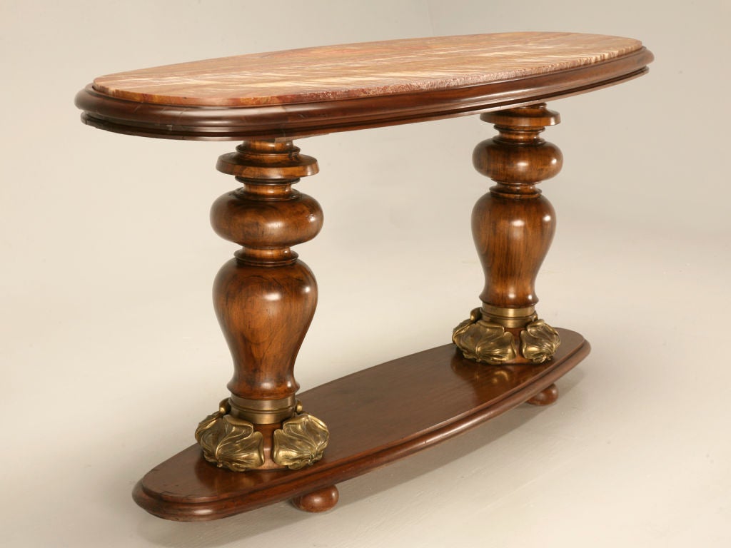 Exquisite Viennese Art Nouveau oblong Console Table made from solid Mahogany with magnificent Bronze clover details and an exotic appearing Onyx top, circa 1890. This is a one of a kind, very important piece of furniture that has been lovingly cared