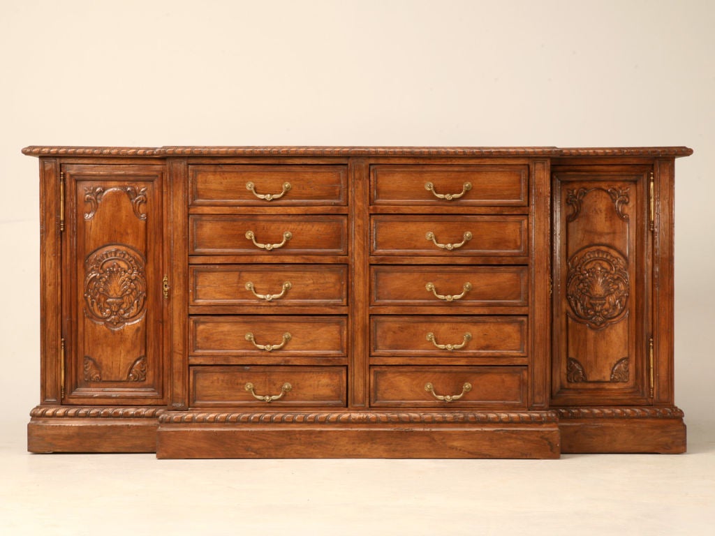 Storage abounds in this magnificent, well constructed walnut break-fronted buffet, or dresser from France. Having ten drawers, and two full height cupboards on either end make this piece the crème d' la crème for hiding life's necessities. Although