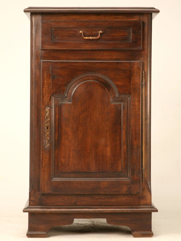 Endless possibilities abound in this special French Confiturier, Small Cupboard. Constructed of solid oak with raised panels, a full door hinge, and a wonderful flip open top, give this fine cupboard plenty of opportunities for utilization. We think
