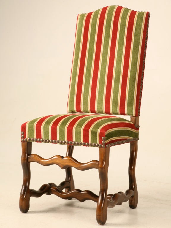Awesome set of twelve (Yes, I said 12) original vintage French Louis XIII or Os de Mouton dining chairs. This set would be great for celebrating with family and friends at large dinner parties or during the holidays. Clean lines mated with