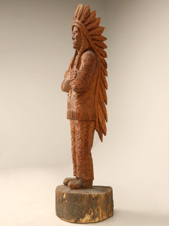 Absolutely incredible vintage chainsaw carved wooden Indian. Perfect many places, this guy would be awesome in a game room, library, wine cellar, or man cave. Signed by it's sculptor, this fine example was entirely carved utilizing no other tools