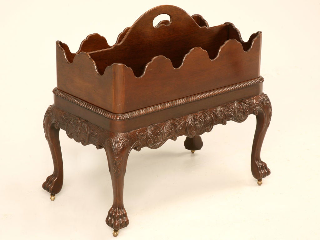 Refined classic Chippendale style 2 piece magazine trug on a carved paw footed stand with brass casters. Perfect in most any room of the home, this fine canterbury could be utilized for most anything from toys to toiletries. Don't miss out on this