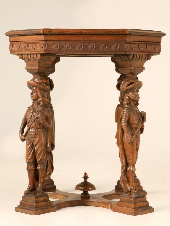 Outstanding antique walnut octagonal lamp table with four figural legs joined by a finial-ed cross-stretcher for added support. Utilized most anywhere within one's home, small tables such as this are completely indispensable. Utilized as a gueridon