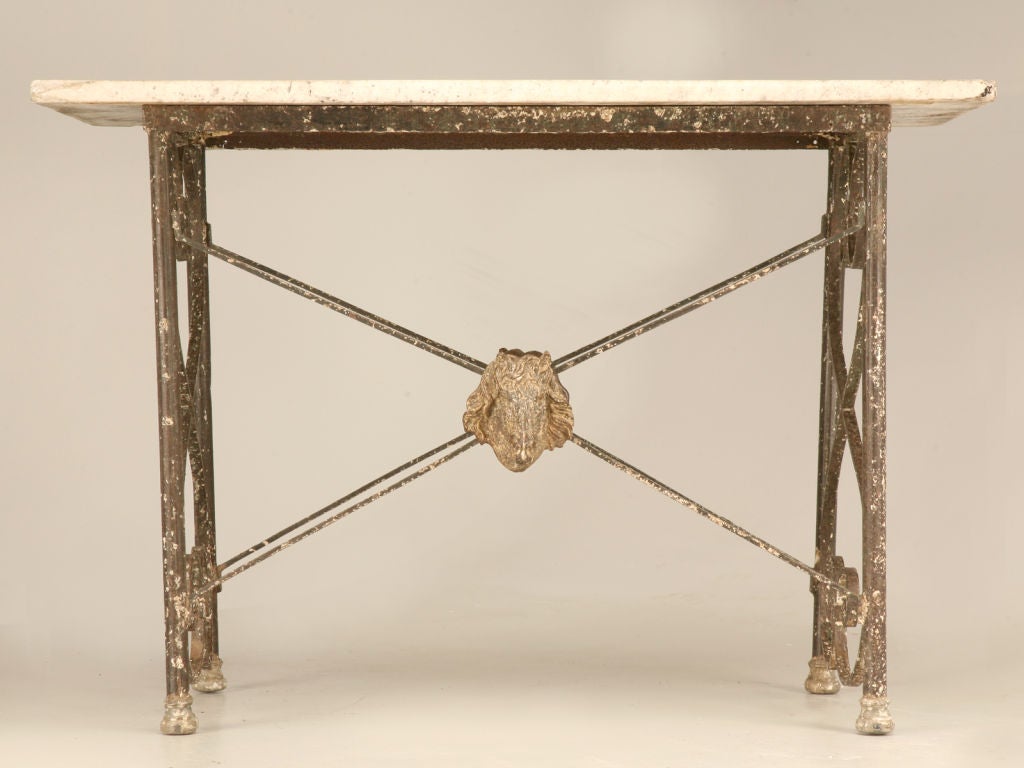 This original antique French Butcher's Presentation Table is unique with four legs held securely with vertical stretchers of scrolls and 