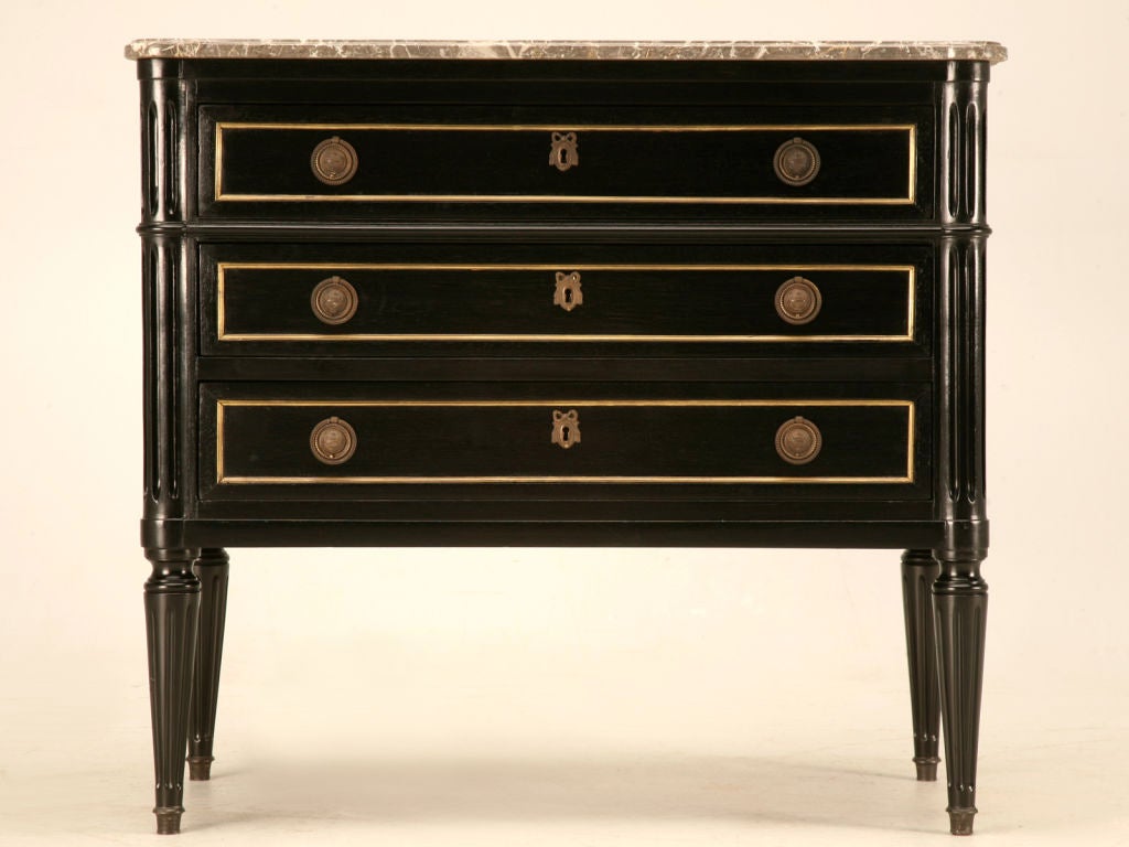 Though petite in size, this awesome commode demands attention with its contrasting brasses against the dark black finish. Exuding charm and character from the moment your eyes see it, this commode exudes quality and workmanship second to none.