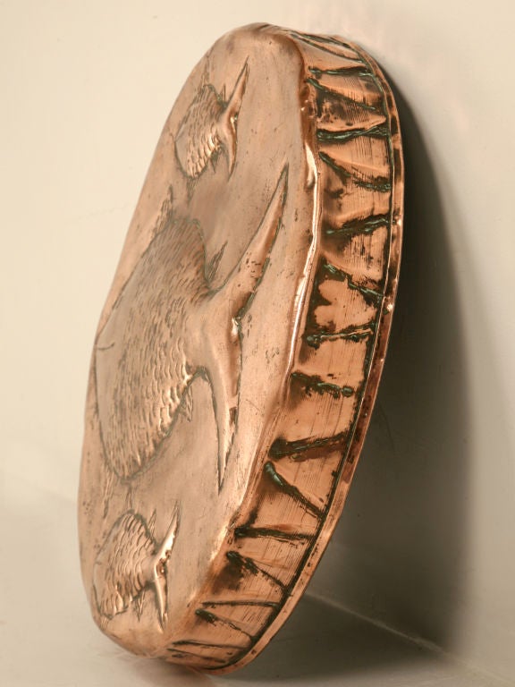 One of three currently in stock, our expert buyer located these copper fish decorated food molds in the south of France. Whether you hang them as decoration or intend to utilize them in cooking, any of these molds are sure to fill the bill. Due to