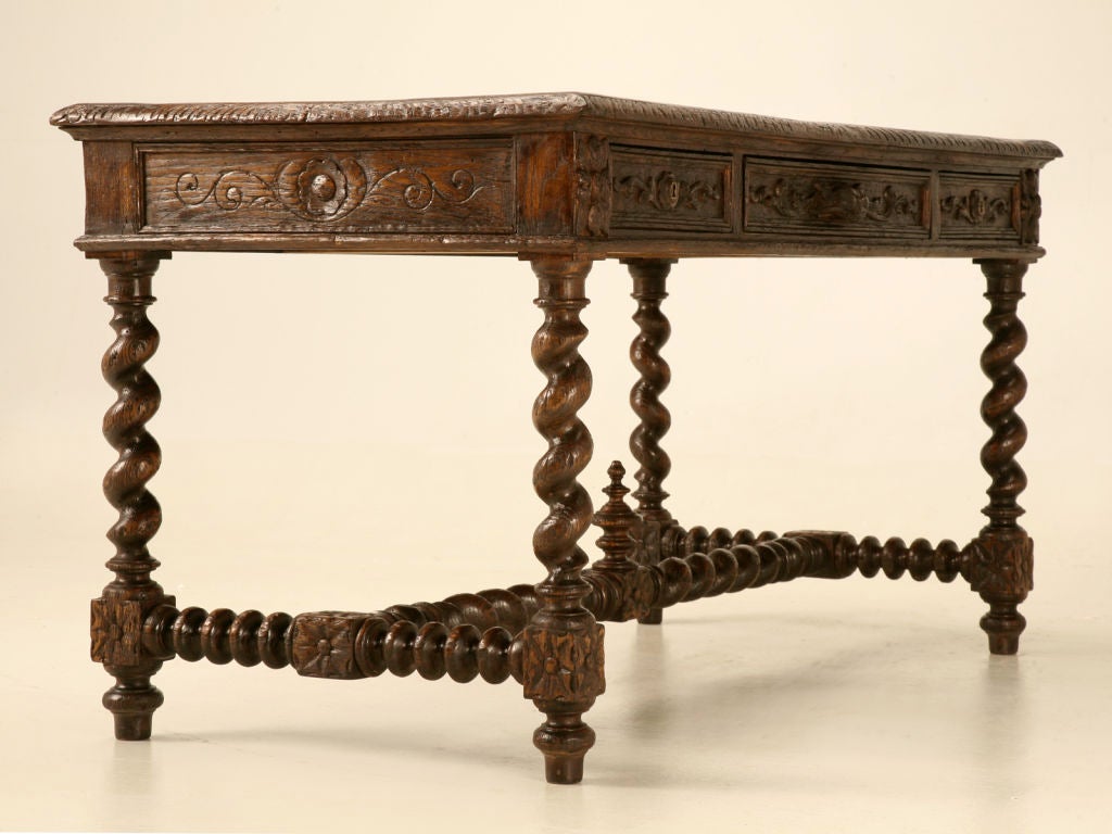 Exquisite hand carved antique French solid oak writing or console table with 3 very useful drawers. Perfect so many places, this fine table would be easily utilized as a writing table floating within a corner of a bedroom or living area, a sofa