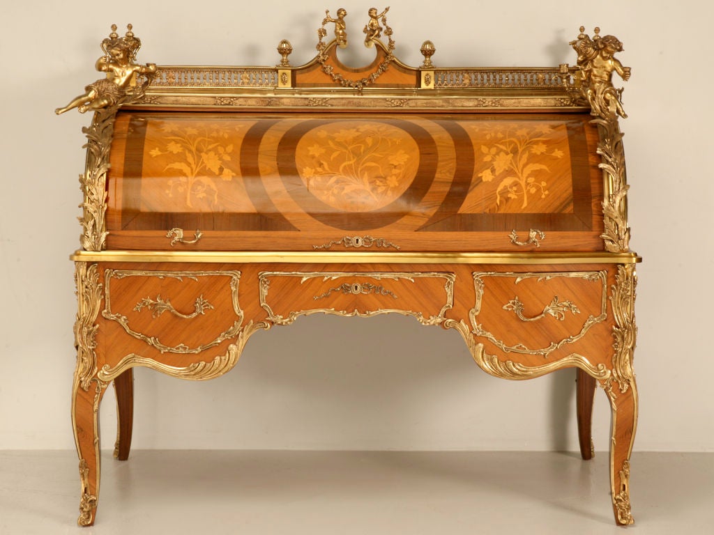 Oooooo-weeeeee---FANCY! FANCY!! FANCY!!! This outrageous vintage Italian desk offers it ALL. An exquisite case of beauty, adorned with intricate marquetry, opulent cast ormolu decorations, all of this besides being purely functional, too. The cute
