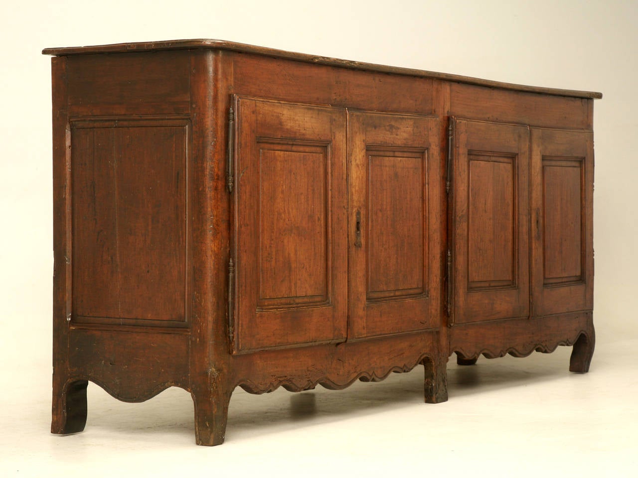 Found in the Midi-Pyrenees region of France, in an unbelievable untouched state. Rare does not aptly describe the finish on this buffet, for no one in over 200 years has tried to refinish it. 
Constructed of French cherrywood in the late 1700s, our