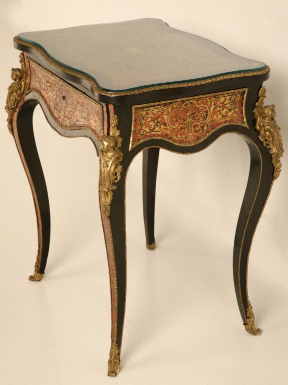 Exquisite craftsmanship is showcased in this fine example of a Boulle table with its flip-top making itself a great dressing table. Originally invented in the 1700’s Boulle’s work is so exceptional that it resides in the Louvre. This table shows off