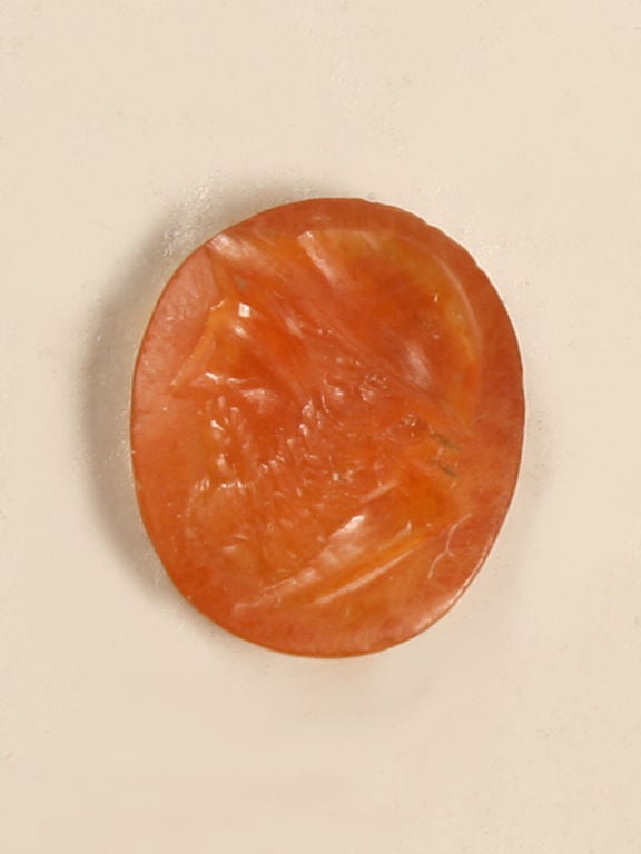 Intaglio is a technique which dates back to antiquity and is still in use at present. Patterns, designs or - more frequently - images are carved or engraved in gemstones leaving a hollow impression in the untouched background. This style of carving