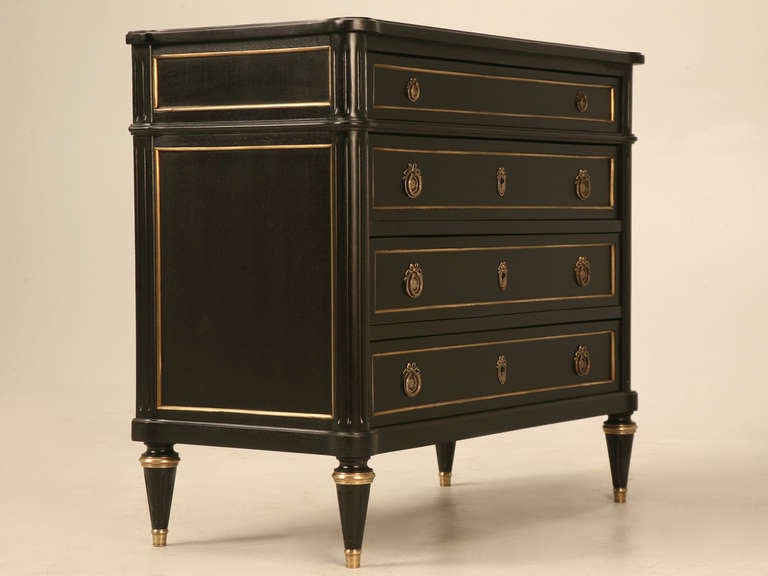 Sleek, sultry and spectacular all identify this charming ebonized French Louis XVI commode. Gracious living abounds when folks in the know utilize stylish as well as functional furnishings in their home. This charming chest of drawers packs a lot of