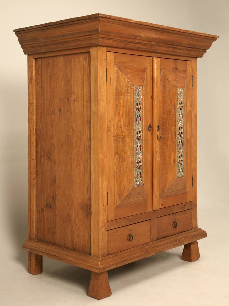 Vintage Indonesian armoire made from teak wood that a client of ours purchased as an antique, and since our knowledge is limited to European antiques, I am more comfortable calling it vintage. Very nice solid construction, and certainly will last a