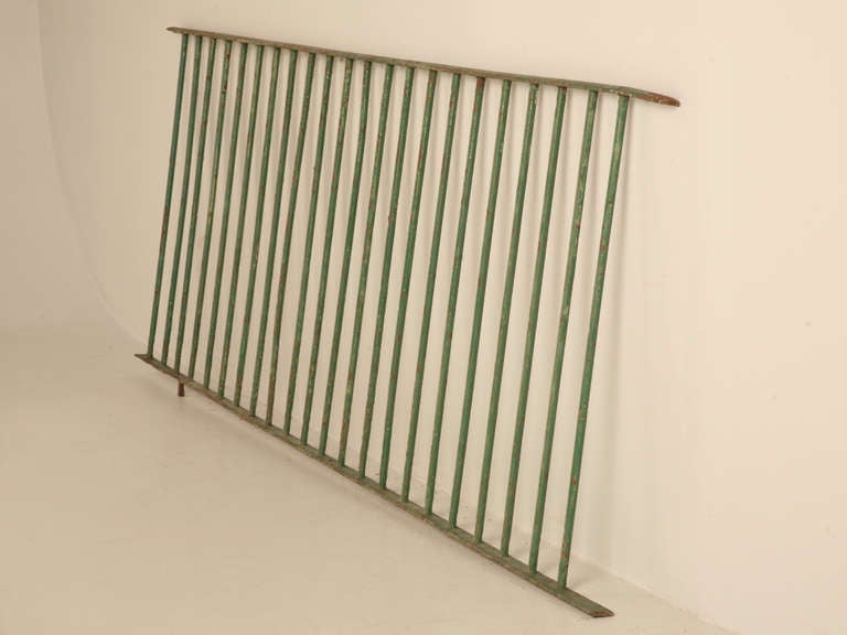 Circa 1920's English fence section in a wonderful old green paint. Perfect as a decorative element in your garden or?