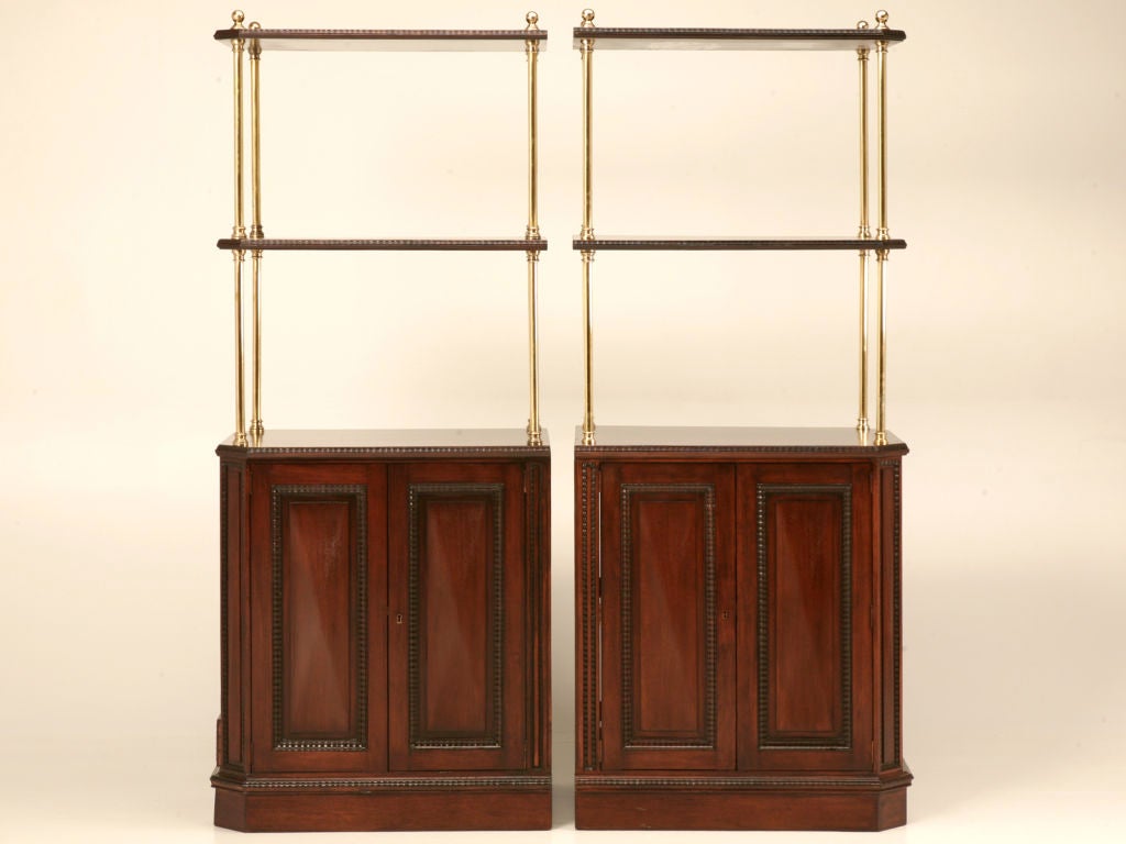 Absolutely phenomenal pair of vintage French solid mahogany host or hostess stands from a famous Parisian brasserie. This pair have a lot to offer, placed back to back they make a stunning island, or back bar utilized separately they are perfect for
