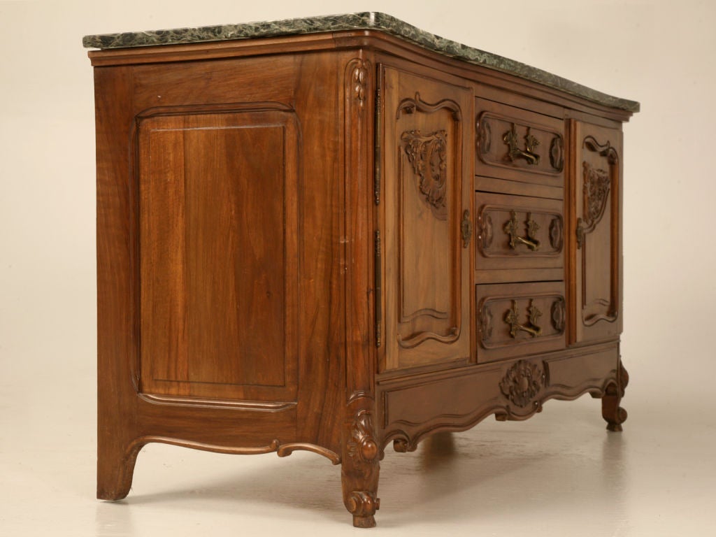 Dynamite vintage French Louis XV figured walnut lowboy with 3 drawers flanked by cupboard ends. With intricate carved details and cabriolet legs, the married green marble top (not original) actually looks good. Easily utilized at the end of the bed