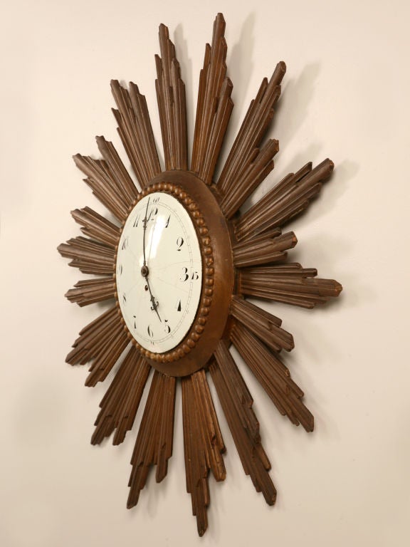 Fabulous find, this amazing sunburst clock is one of only two we have ever had the opportunity of owning, the other is in our store owner's personal collection. While we have a penchant for sunburst mirrors and are always searching; clocks just seem
