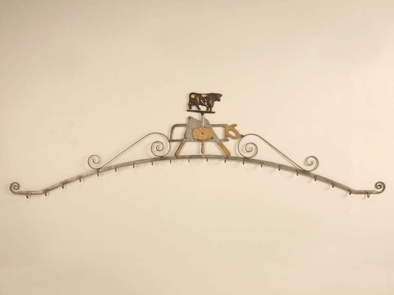 ,We are proud to offer this outstanding 100% original antique (circa 1889), Bernard Gloekler Co. of Pittsburgh, Pa, meat rack with an intricate bolted construction of wrought and cast iron. An arched bar with scrolled ends having 20*** wrought meat