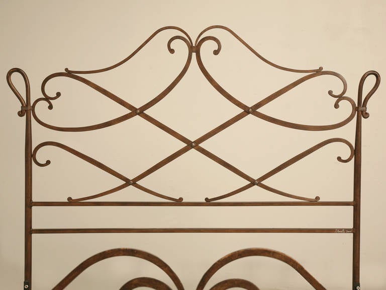 Vintage Queen size hand forged iron bed in a Gilbert Poillerat inspired design. This was not however made by, or designed by Gilbert Poillerat, but if you look at his fireplace screens, it does not take a lot of imagination to see why this bed is so