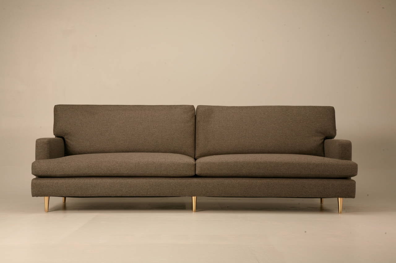 Classic Mid-Century Modern design sofa made to order in any dimension here in Chicago. Frame is constructed from hard-wood, 8-way hand-tied coil springs and high-quality padding materials. Priced COM (customer own material).