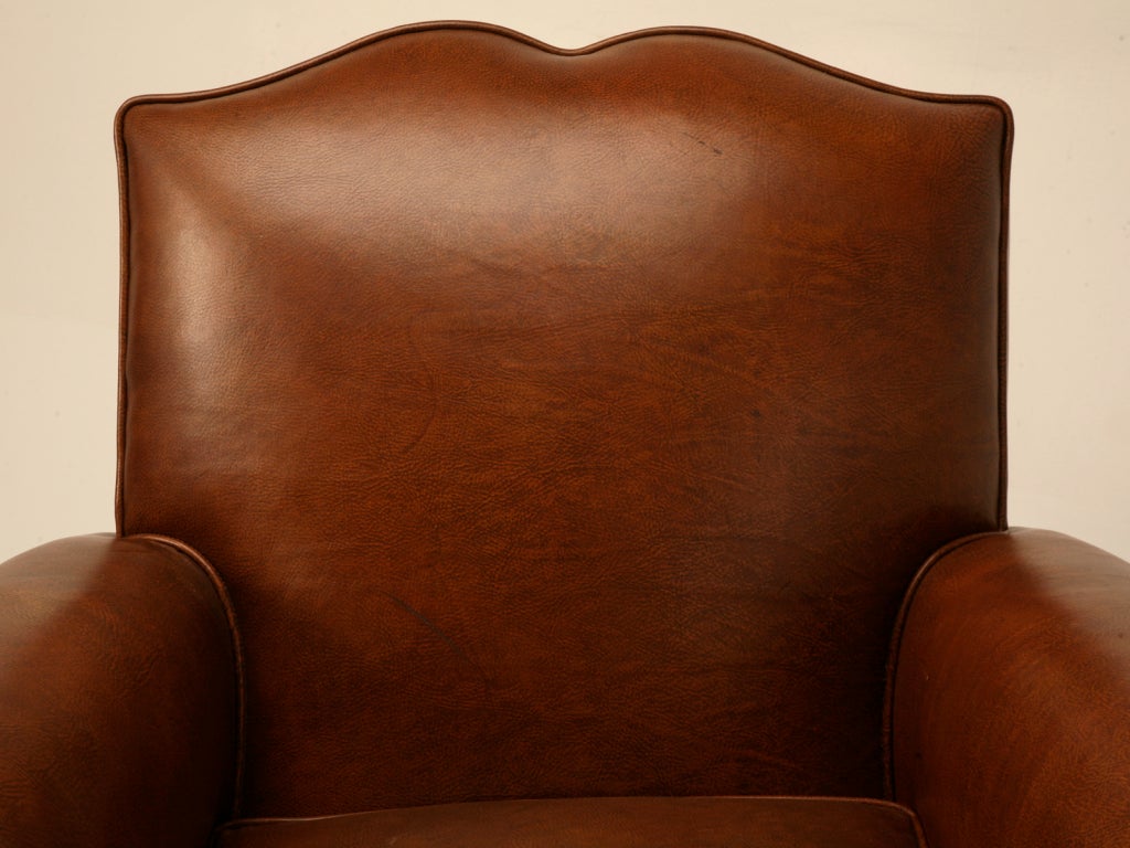 Entirely stripped down to their bare wood frames, this pair are now good as new if not better. Not to be confused, these are not copies, this is an original pair of vintage French 1940's moustache back club chairs that have been thoroughly restored.