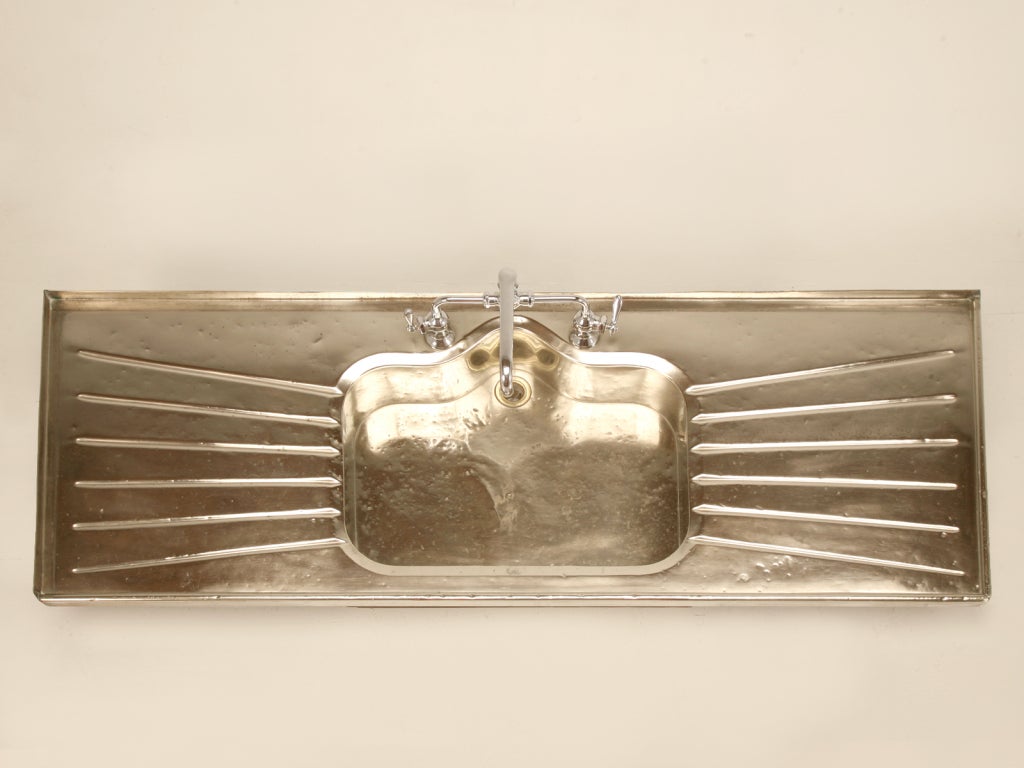 This beautiful antique German silver sink originated in the early 1900’s. Unfortunately, by the mid 1930's, stamped stainless steel sinks took over their place in the market. Not manufactured again until 1994 when a Suburban Detroit Kitchen & Bath