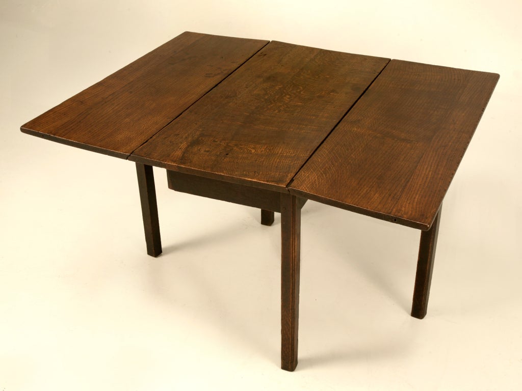 Purchased many years ago in Derby England, this fine table utilizes a single board for its top and each of the two leaves. No matter where or how you use this table it is sure to bring you many years of fond memories. In the breakfast nook for