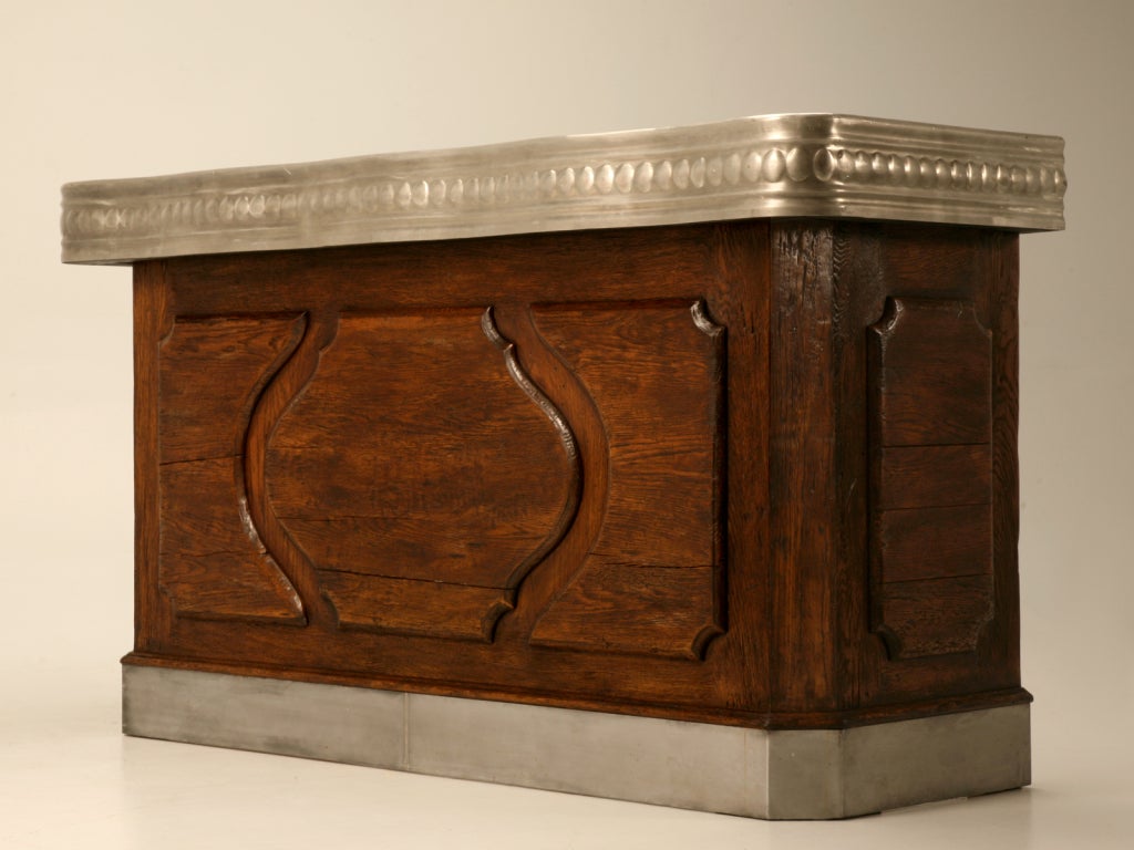 Awesome extremely high quality authentic copy of a 19th century French bar made from French solid white oak with a hand-formed solid pewter top. This bar is stunning, from its hand formed pewter, to its distressed solid oak construction. Utilize