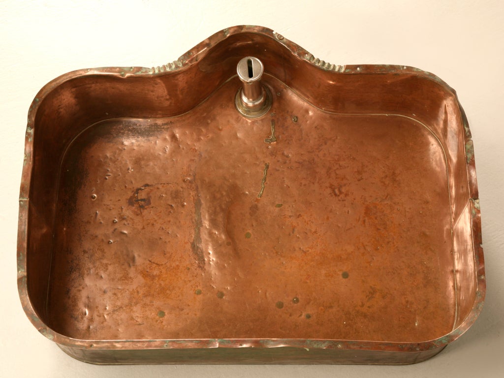 Rescued from a fine 19th century home on Chicago's North-Shore, this stunning copper sink has been used daily for more than a century. An interesting and unique shape give this fine bowl added character and charm. Used in the kitchen as a prep sink,