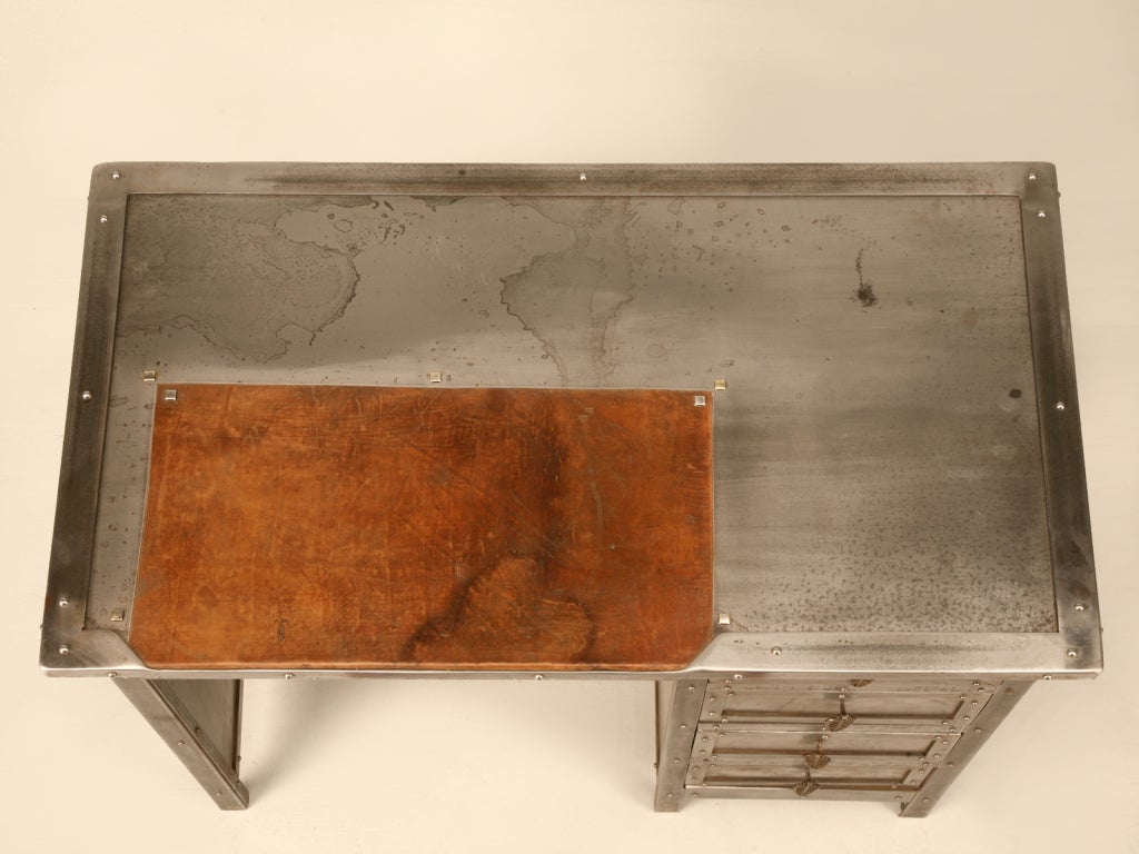 This fantastic find has stolen all of our hearts here at Old Plank. With so many details, I'm not quite sure where to start--petite in size, this authentic jewelery makers desk offers sturdy solid wood construction covered with industrial steel, 4