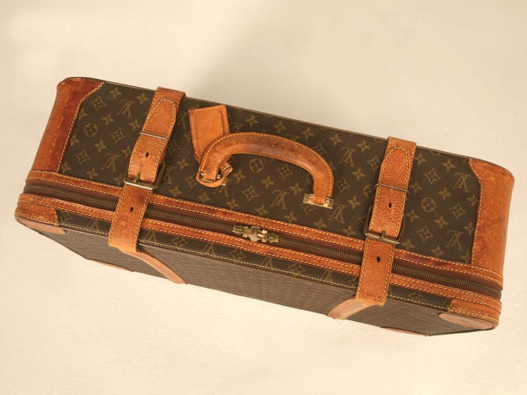 Whoa stop scanning all the other fascinating finds and enjoy gazing at this super cool authentic LV monogrammed canvas suitcase. Purchased with the plans of making a stand for it to be utilized as a unique and striking end, side or coffee table with