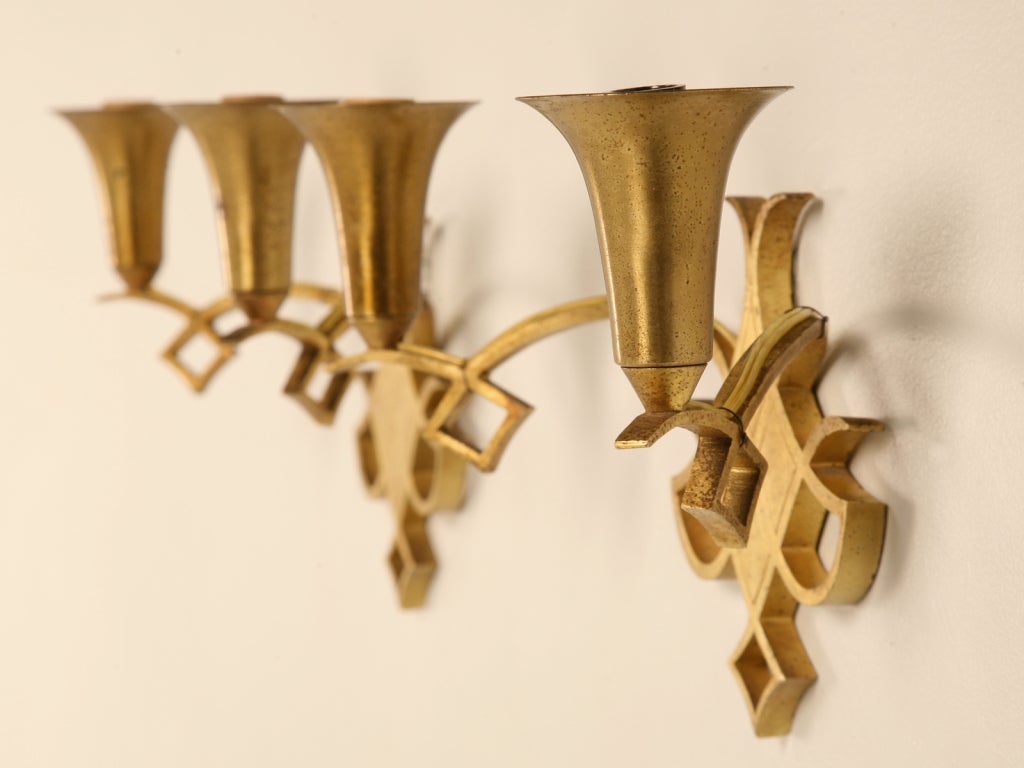 Dynamite pair of original mid-century French Art Deco sconces attributed to the renowned designer Raymond Subes. This fine pair of sconces offer more charm, sophistication, and design personality than one would ever expect. The overall design