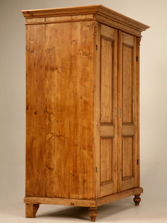 Magnificent original antique English pine armoire that has been converted to an entertainment center however, easily changed back. This gorgeous pine armoire is in very good condition, the structure is strong and it functions beautifully. Subtle