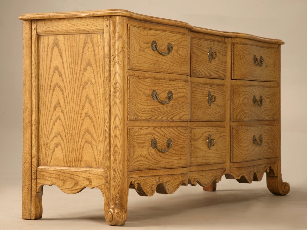 Vintage Baker Furniture Company serpentine front Louis XV style 9 drawer dresser, buffet, or possible sink base. Constructed of solid wood, it has 9 dovetailed drawers and an amazing cerused finish.