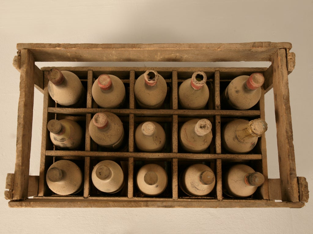 Amazing authentic French wine crates containing whats left of their original vintages. We purchased them in Toulouse and thought they made perfect props or decorations. As you can see by our photos, they are original with their dust, dirt, and