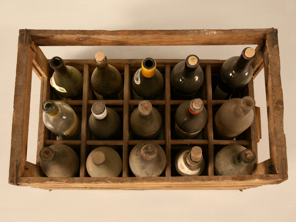 Amazing authentic French wine crates containing whats left of their original vintages. We purchased them in Toulouse and thought they made perfect props or decorations. As you can see by our photos, they are original with their dust, dirt, and