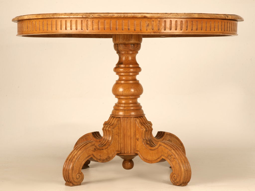 Late 19th Century Ovoid Antique Continental Elm Table with Marquetry Diamonds and Stars