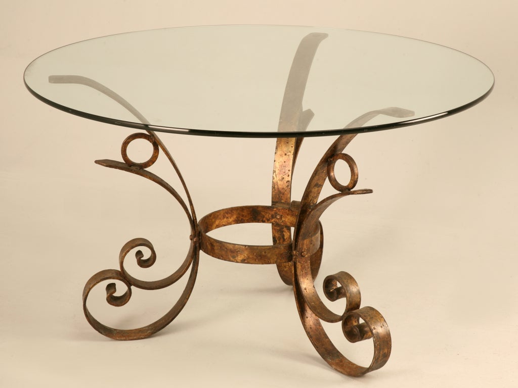 Being a unique height makes this stunning vintage Italian table the perfect candidate for cards, board games, or dining without ever leaving the comfort of your couch. Scrolled steel provides stability while its gilded finish adds shimmer and