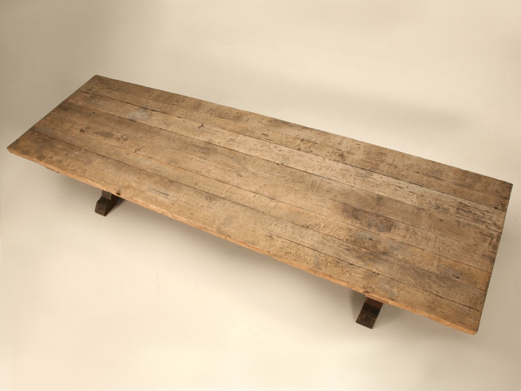 Vintage handmade weathered French white oak farm table. This table began its life here, in our very own Old Plank Workshop where it was custom ordered to be utilized as an outdoor picnic table, as you can see in the pictures it was, Naturally