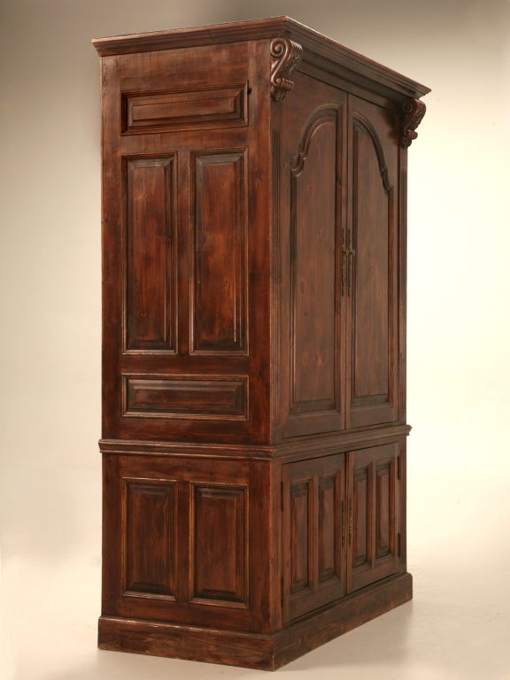 Hand constructed of solid English pine (stained cherry), this large 2 piece cabinet would hold a plethora of goodies. Originally built to house a large TV and other multi-media equipment, this special cabinet even offers pocket doors for the upper
