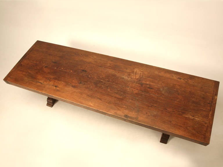 Circa 1880-1900 French white oak trestle table, with an incredible three and one-half inch thick wide plank top. We decided to leave the finish up to the purchaser, since it currently has a lovely old patina, and besides you would not be afraid if
