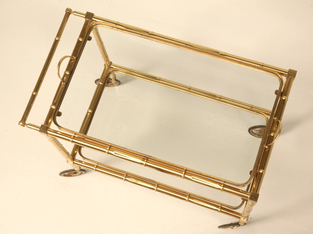 Classic faux bamboo furniture cast in brass was often used by many famous French design houses such as Maison Bagues, Maison Jansen and Jacques Adnet. The shape and detail of bamboo offers a classic aesthetic without being overly plain or